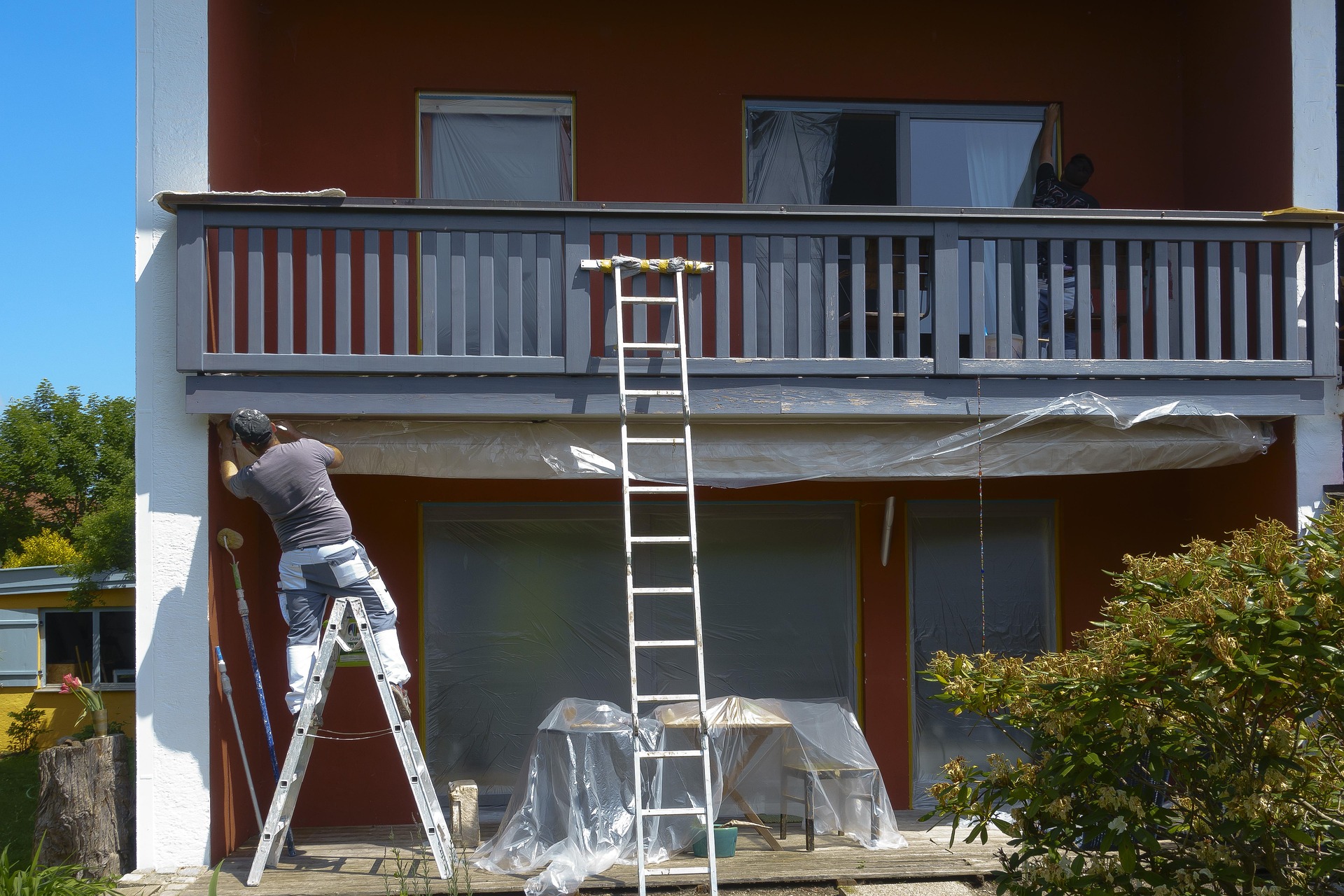 Professional painter applying fresh paint to an interior wall