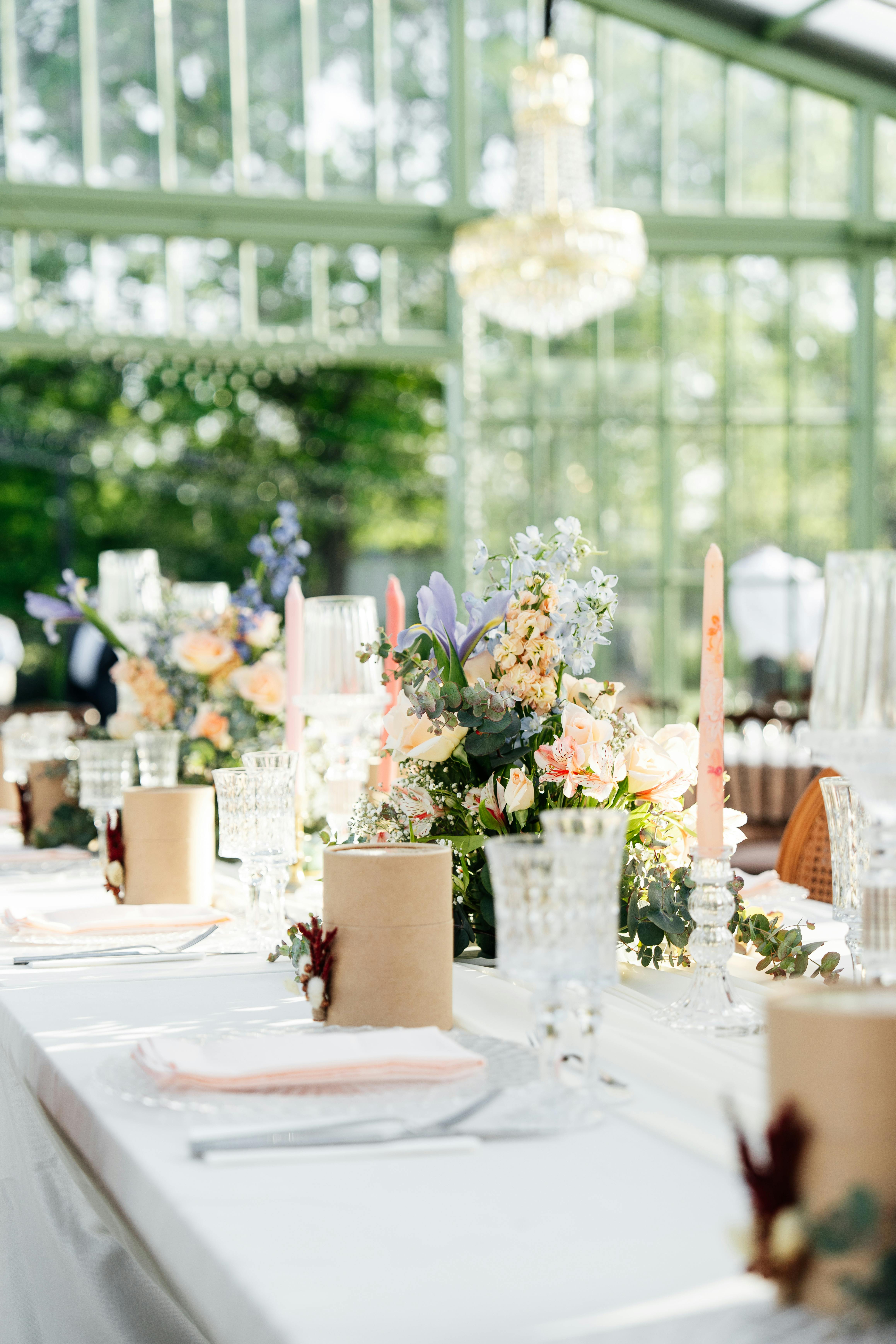 Elegant event table setup with flowers and candles
