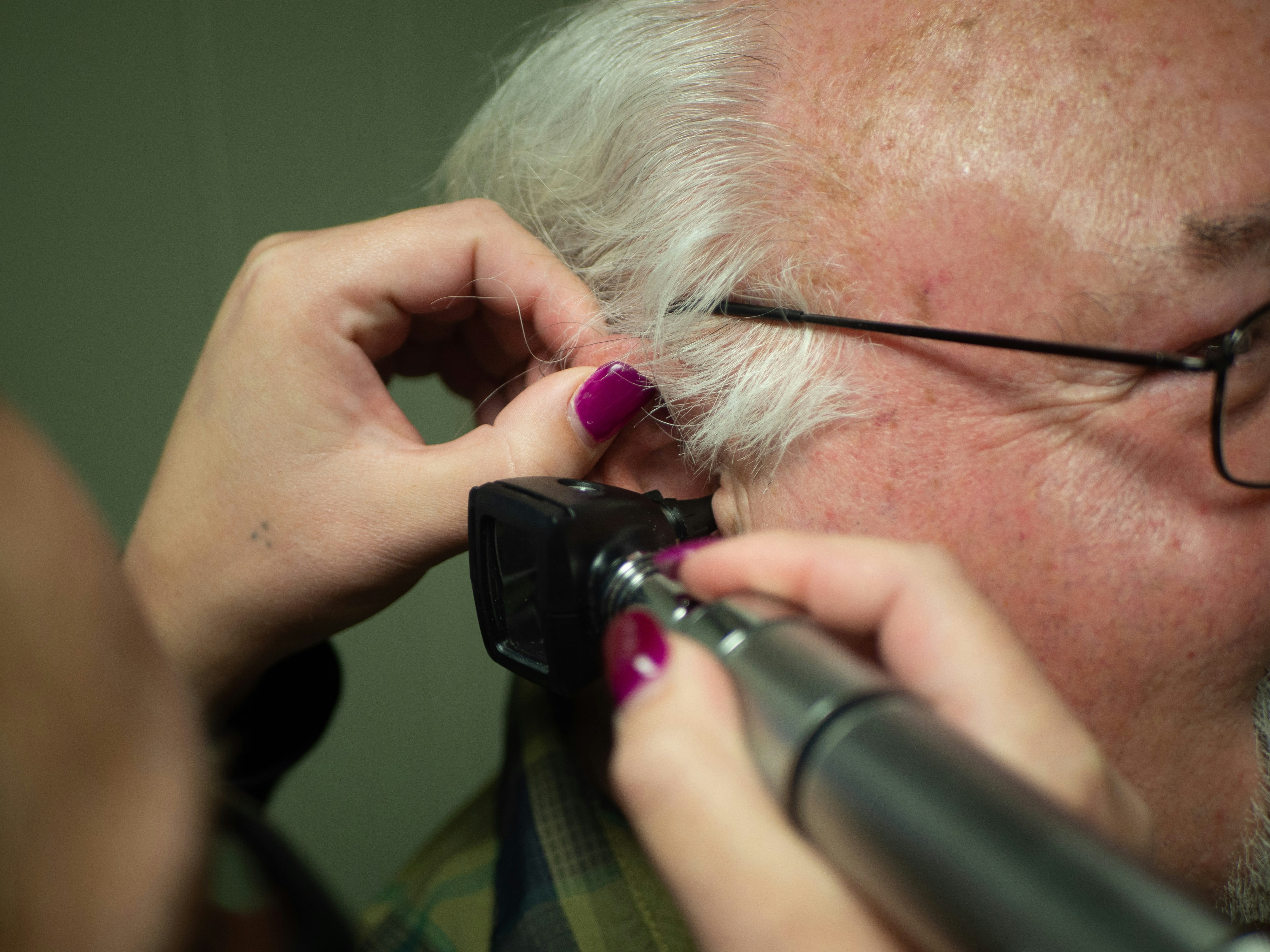 Audiologist consulting with a patient during a hearing care appointment