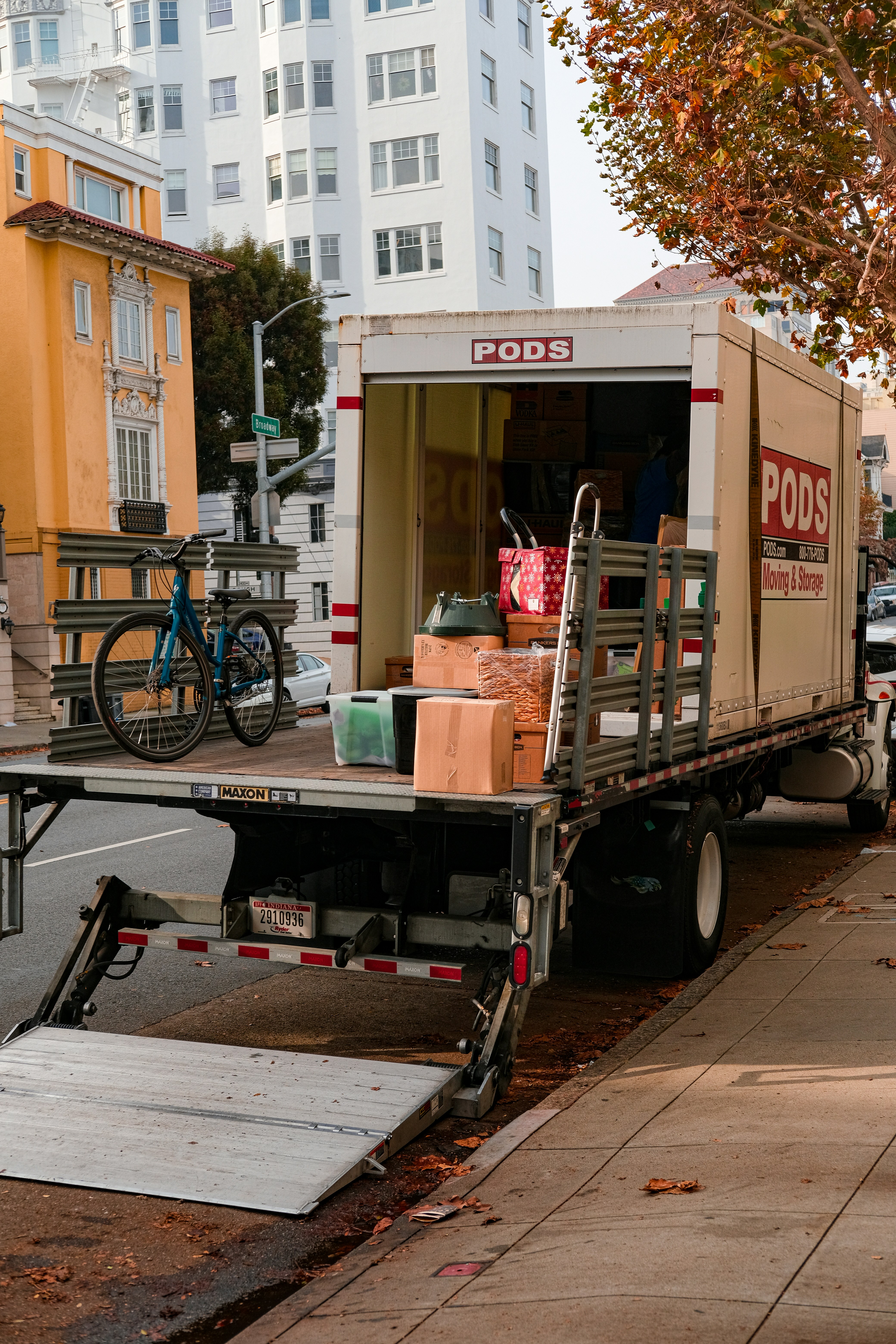People loading items into a trailer
