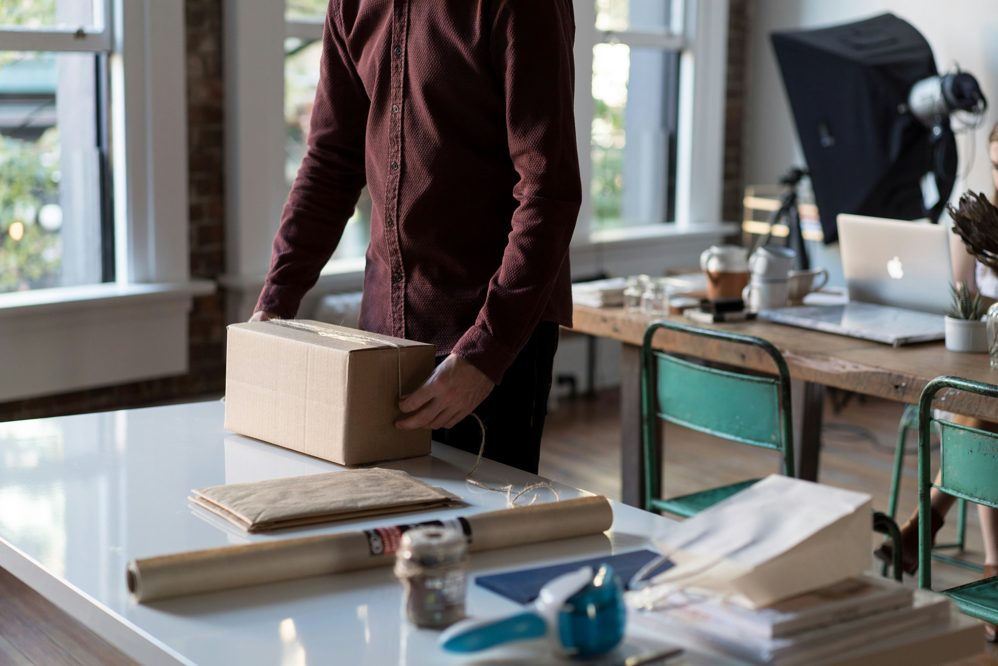 Small business packing online orders at a dispatch table