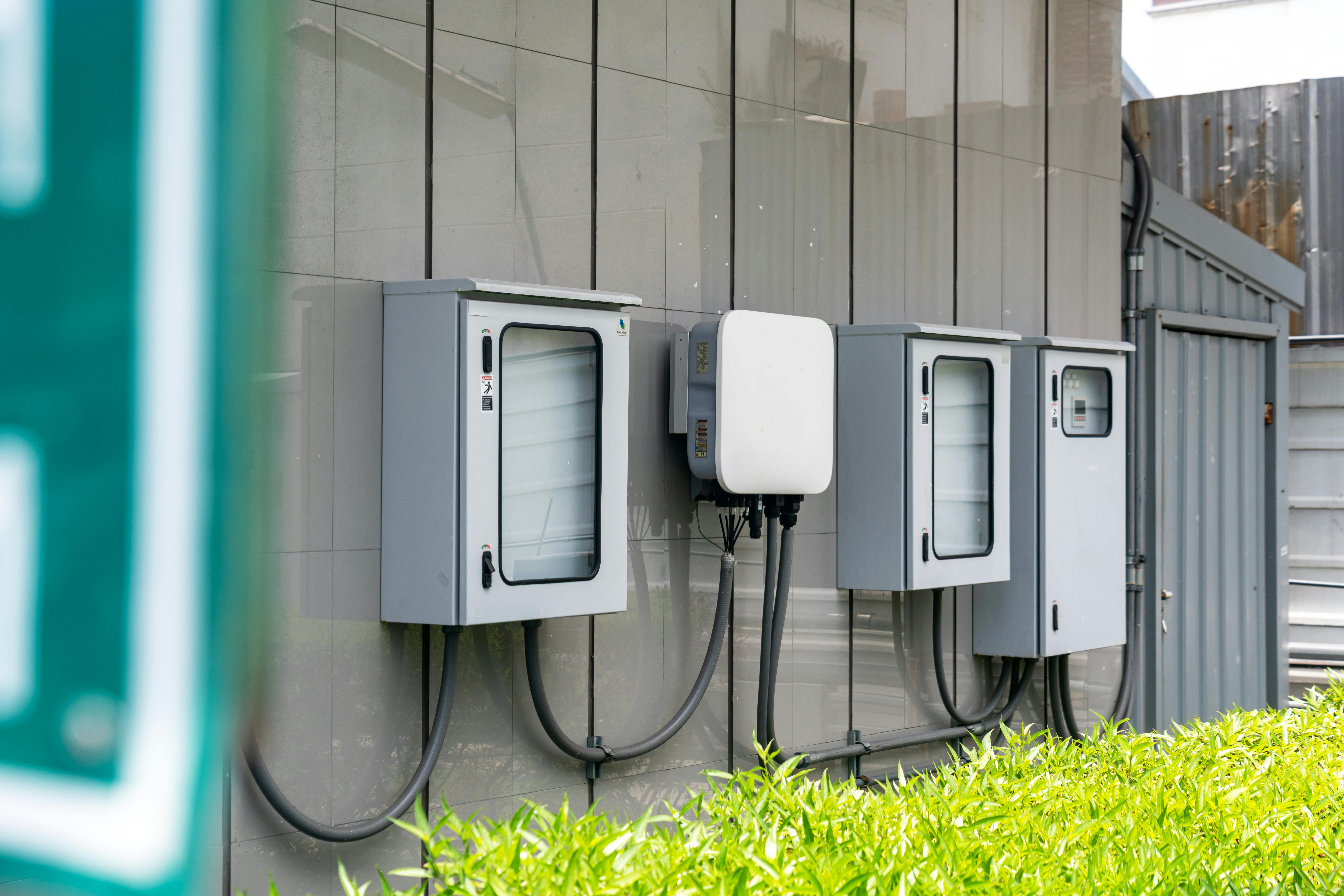 Backup power technician working on an inverter and battery system