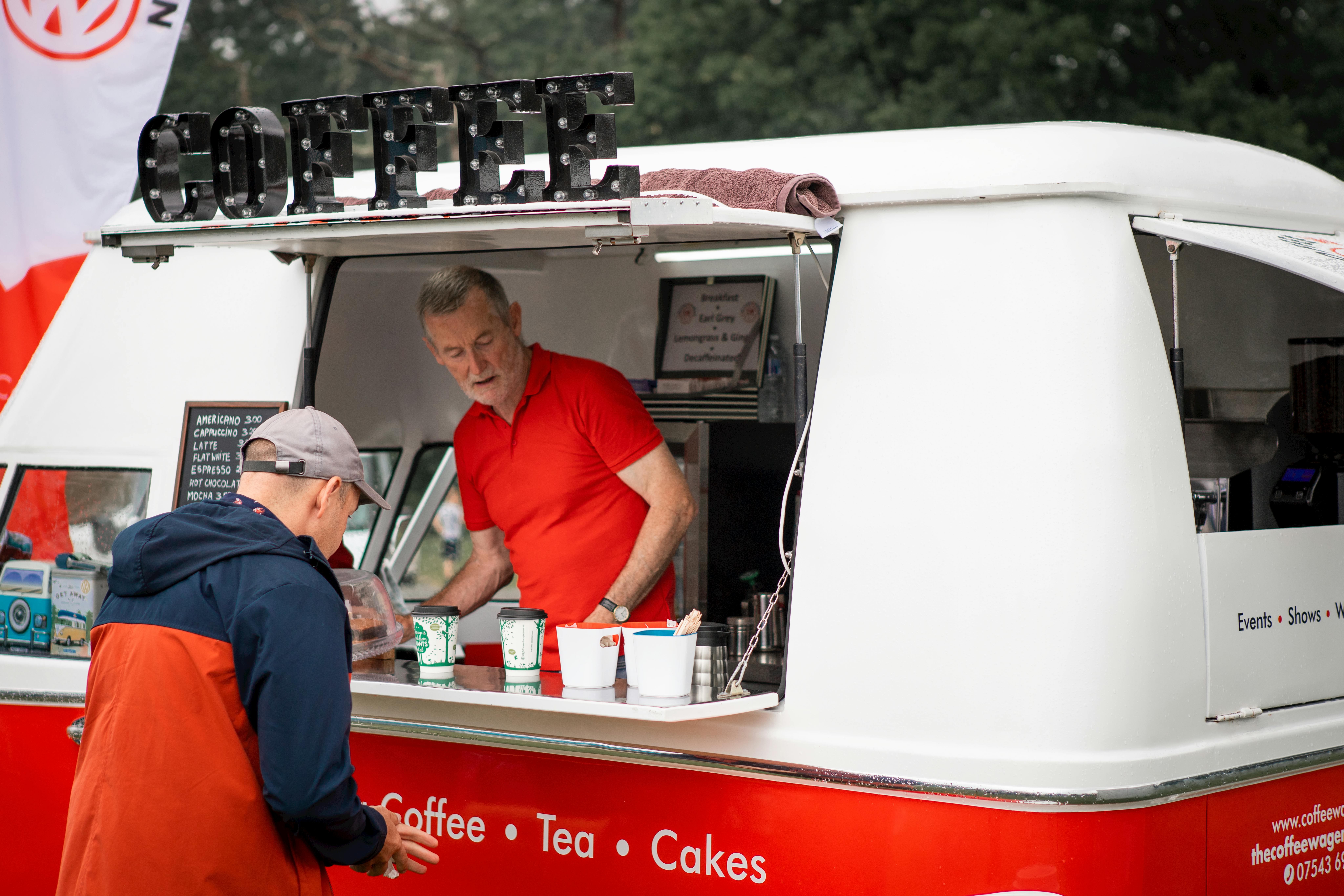 Barista serving coffee at an event